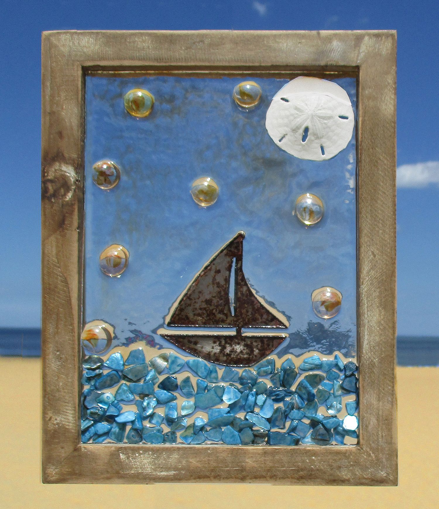 Rusty Scrap Metal Sailboat In An Ocean Of Blue Abalone Shells, With An In 2017 Sand And Sea Metal Wall Art (View 10 of 20)
