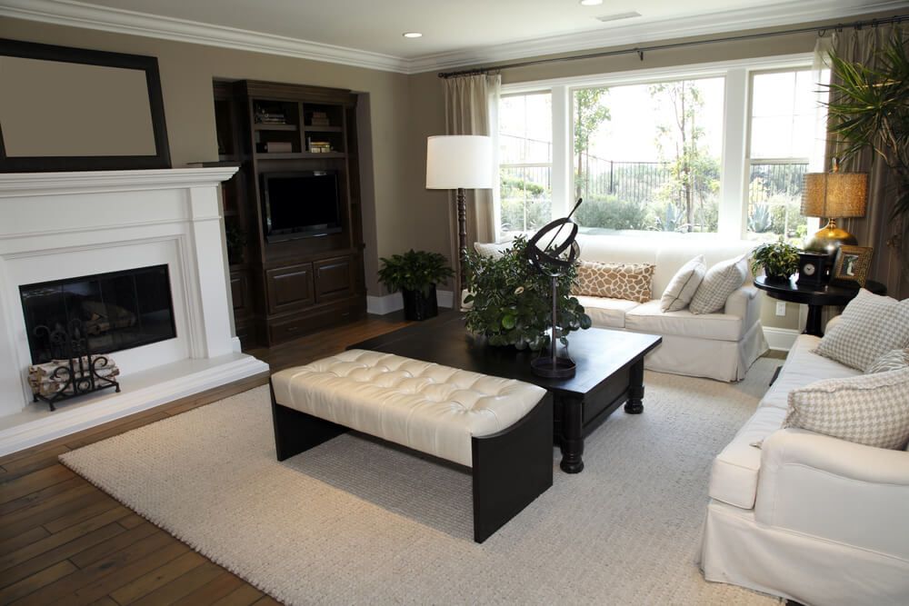 47 Beautiful Living Rooms With Ottoman Coffee Tables Intended For Natural Beige And White Short Cylinder Pouf Ottomans (Gallery 19 of 20)