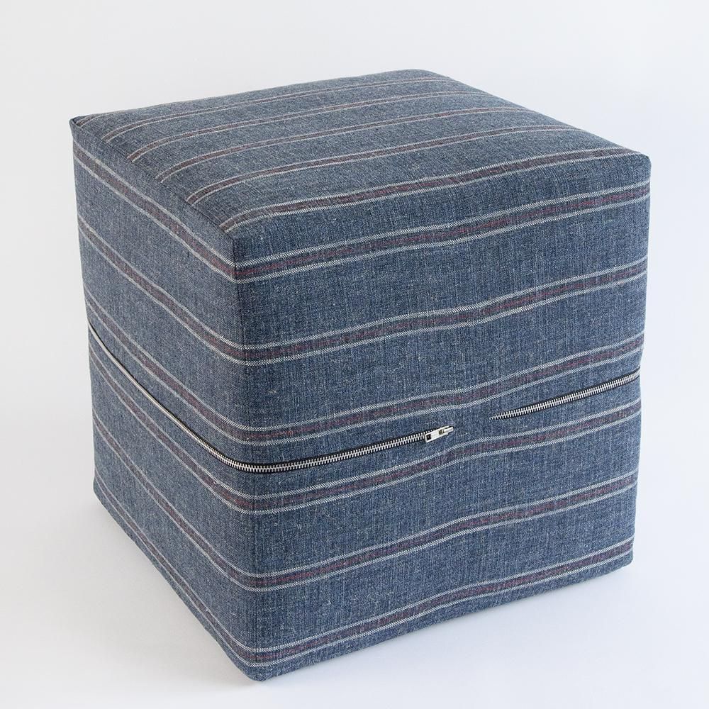 A Stunning Coastal Inspired Ottoman With Rows Of Soft White, Charcoal Within Charcoal And White Wool Pouf Ottomans (View 12 of 20)