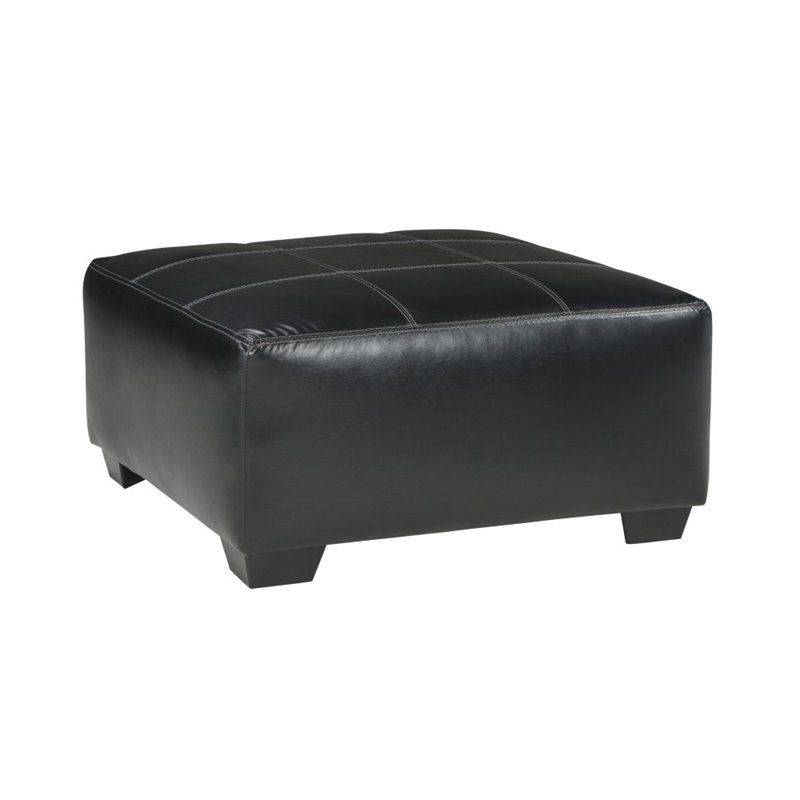 Ashley Kumasi Oversized Square Faux Leather Ottoman In Black Within Black Leather Foot Stools (View 16 of 20)