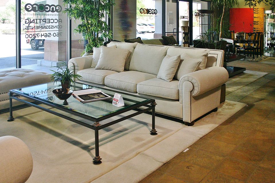 Beige Sofa With Rectangle Glass Coffee Table – Encore Consign + Design Throughout Ecru And Otter Console Tables (View 15 of 20)