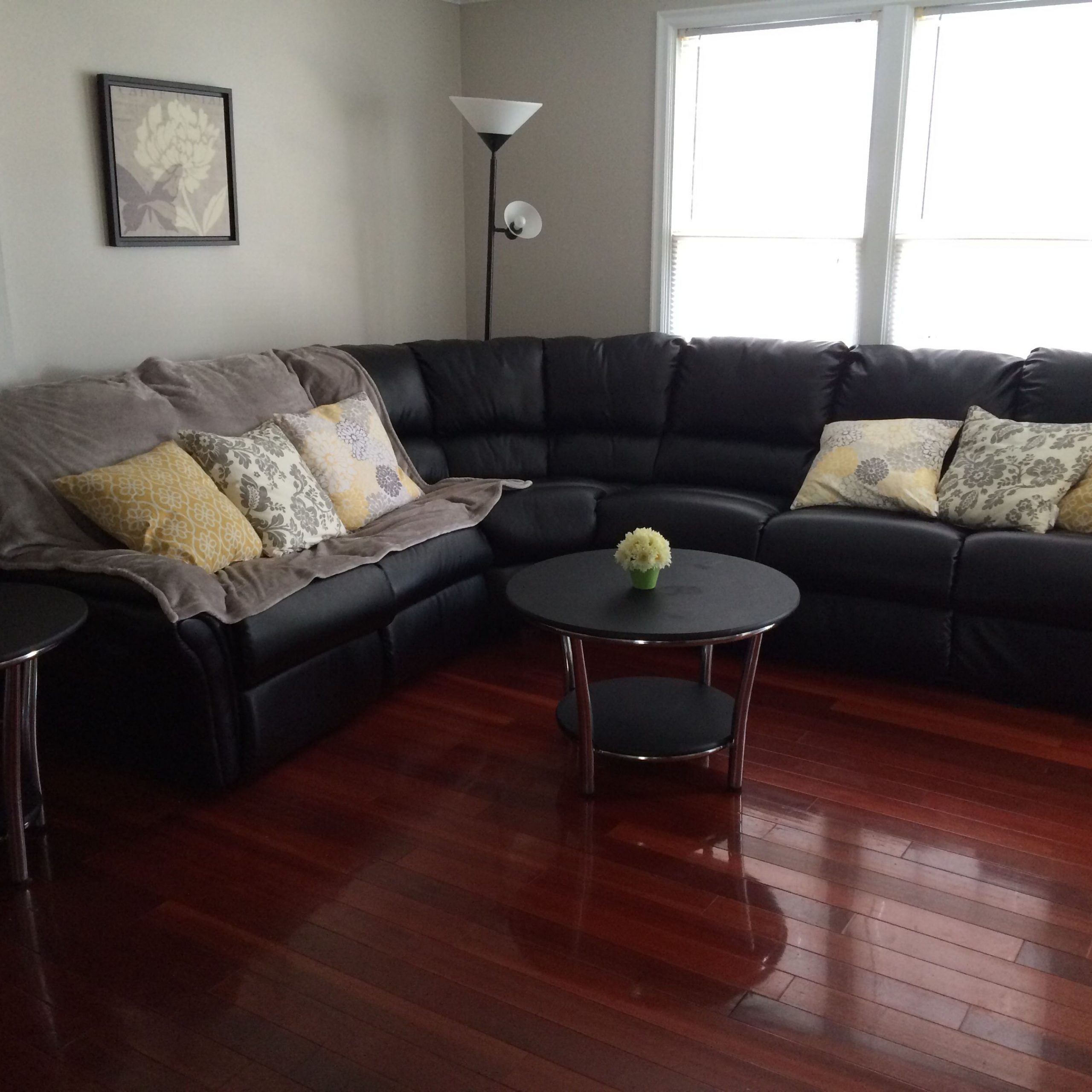 Black Sectional Couch With Yellow Throw Pillows And Cherry Hardwood Throughout Yellow And Black Console Tables (View 10 of 20)