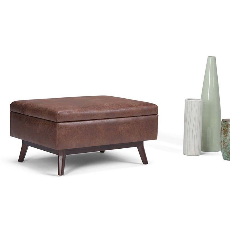 Simpli Home Owen Faux Leather Storage Coffee Table Ottoman In Saddle Throughout Espresso Leather And Tan Canvas Pouf Ottomans (View 10 of 20)