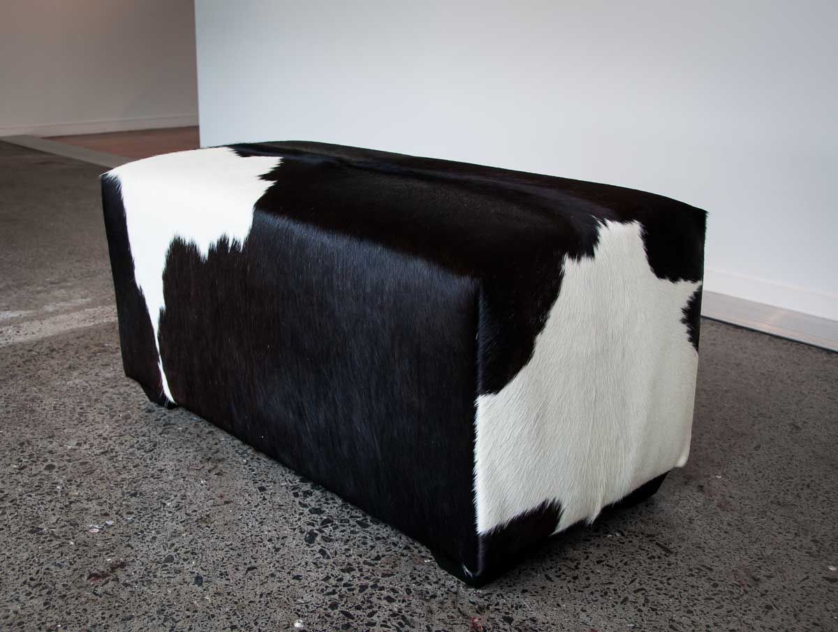 This Deep Black And White Cowhide Ottoman Is Perfect For A Walk In With Warm Brown Cowhide Pouf Ottomans (View 20 of 20)
