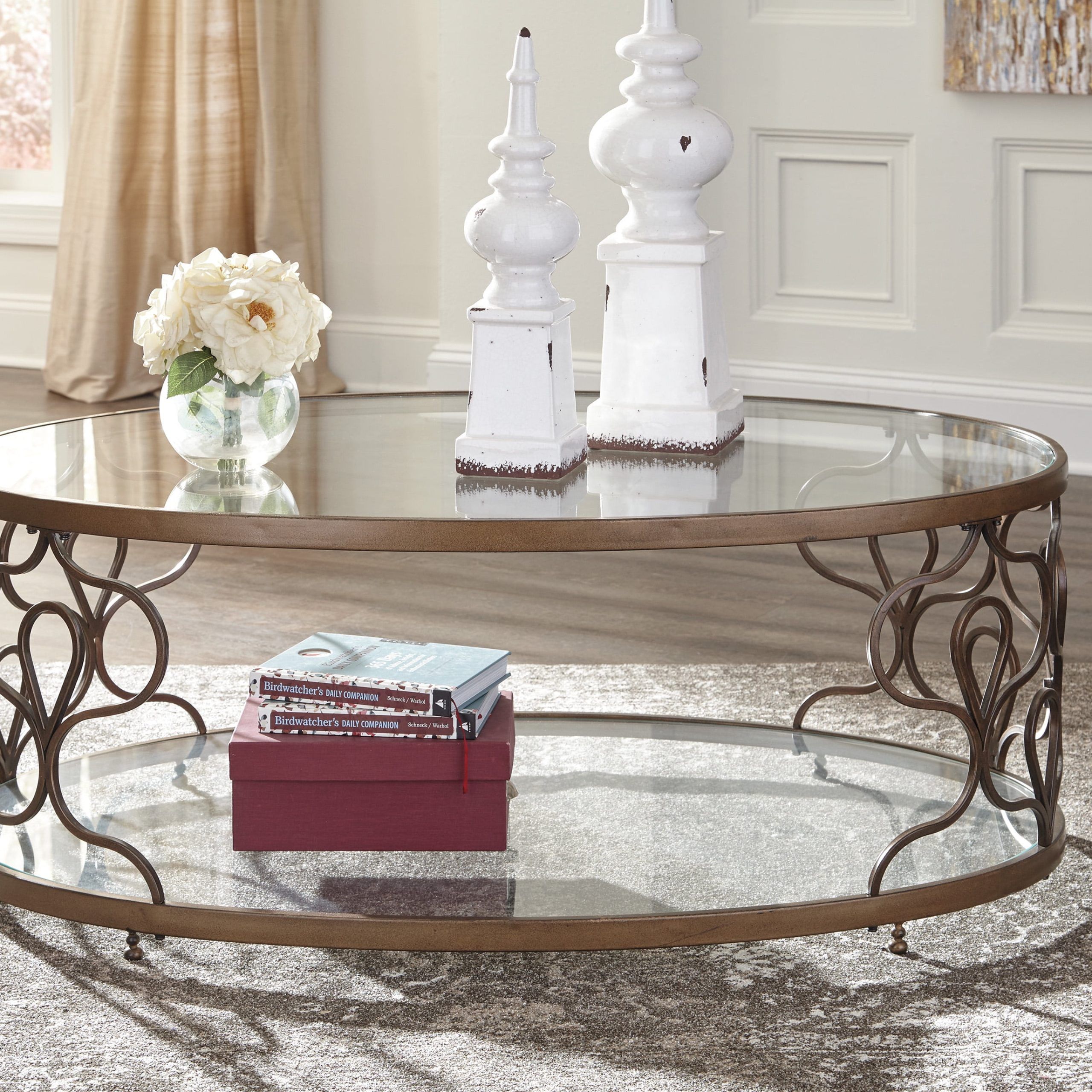 Ashley Furniture Fraloni Bronze Finish Oval Metal Coffee Table With Throughout Oval Glass Coffee Tables (Gallery 18 of 20)