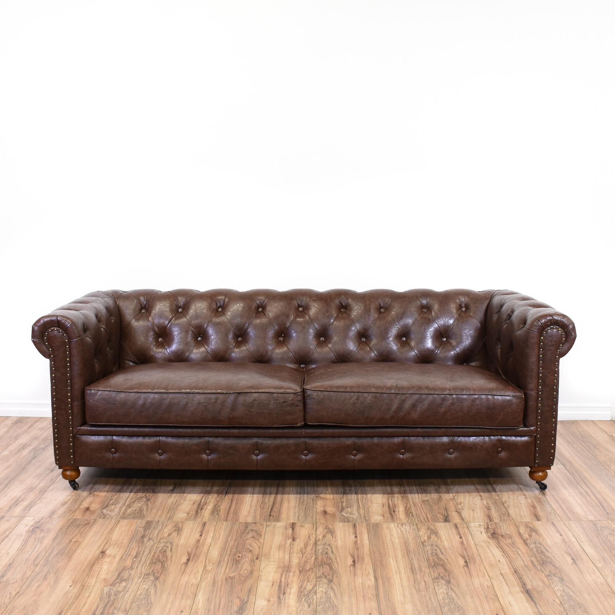 This Chesterfield Sofa Is Upholstered In A Faux Brown Leather With A Within Faux Leather Sofas In Dark Brown (Gallery 9 of 20)
